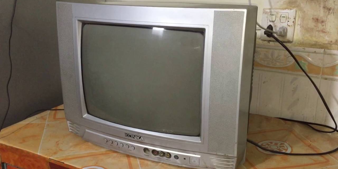 Old silver CRT television awaiting recycling